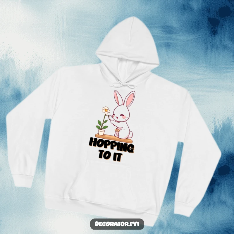 Funny rabbit hoodie showing a perky rabbit carefully placing a delicate flower on a shelf, ready to nurture.