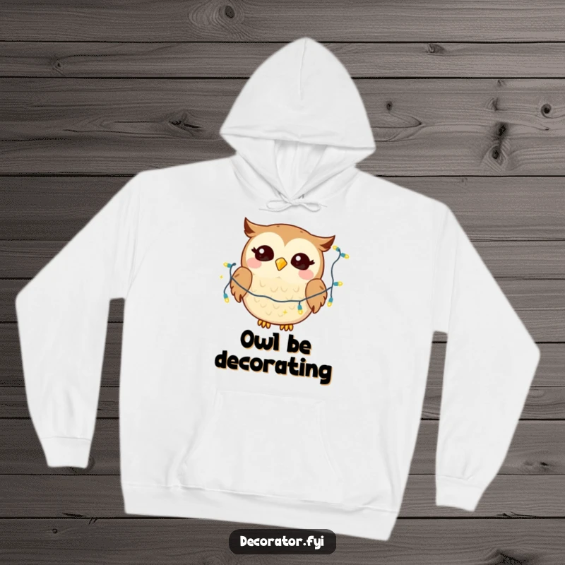 Funny hoodie depicting a giggling owl character joyfully draping a string of twinkling lights, perfect for cozy humor.